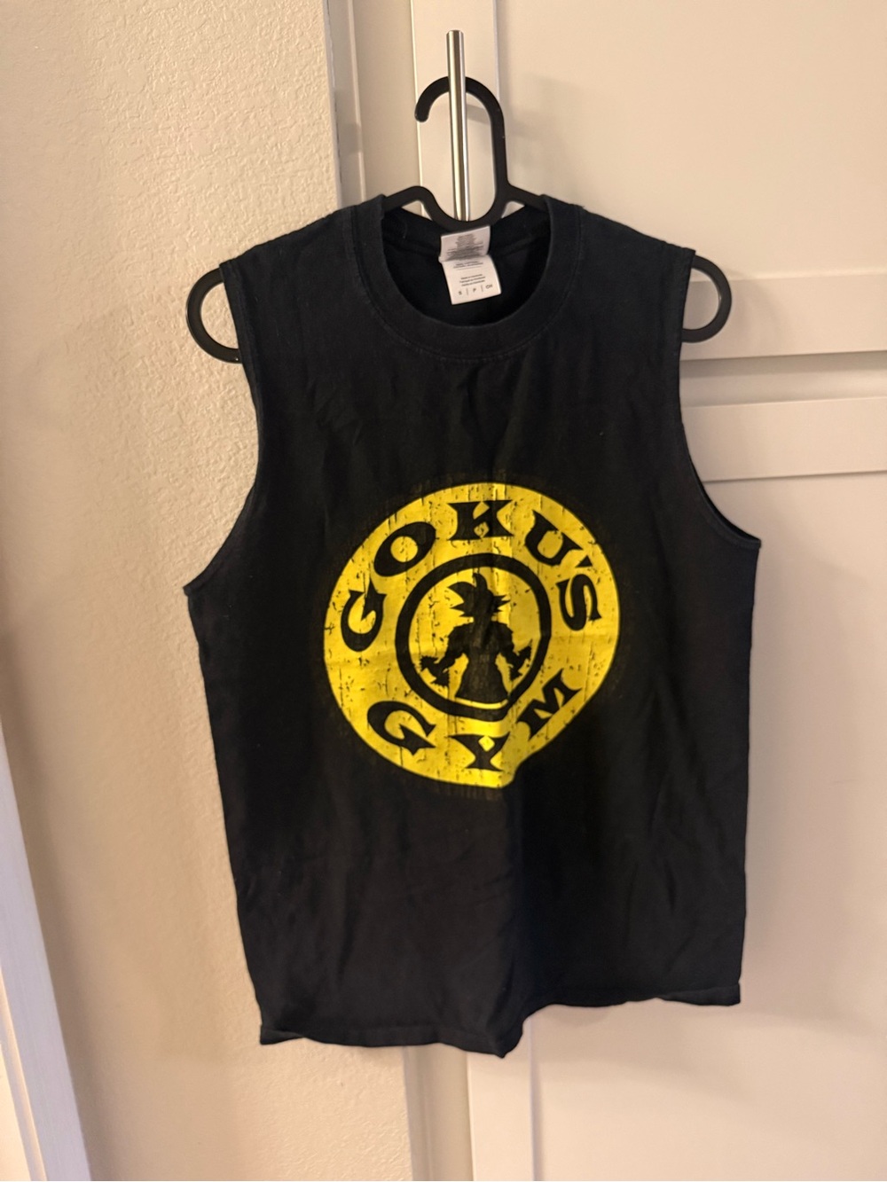 Black unisex Graphic Muscle Tee with Yellow Goku Logo